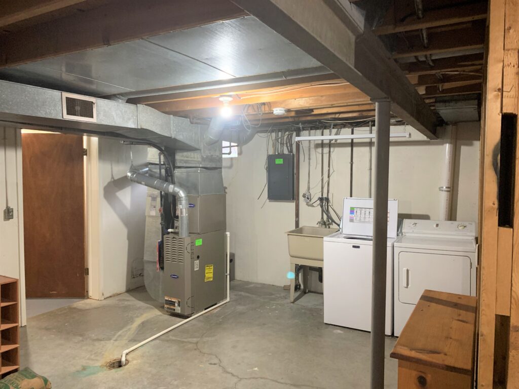 3212 Melody Lane basement and washing machine